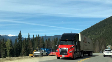 CN intermodal truck crossing Canadian landscape