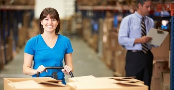 A warehouse employee moving freight