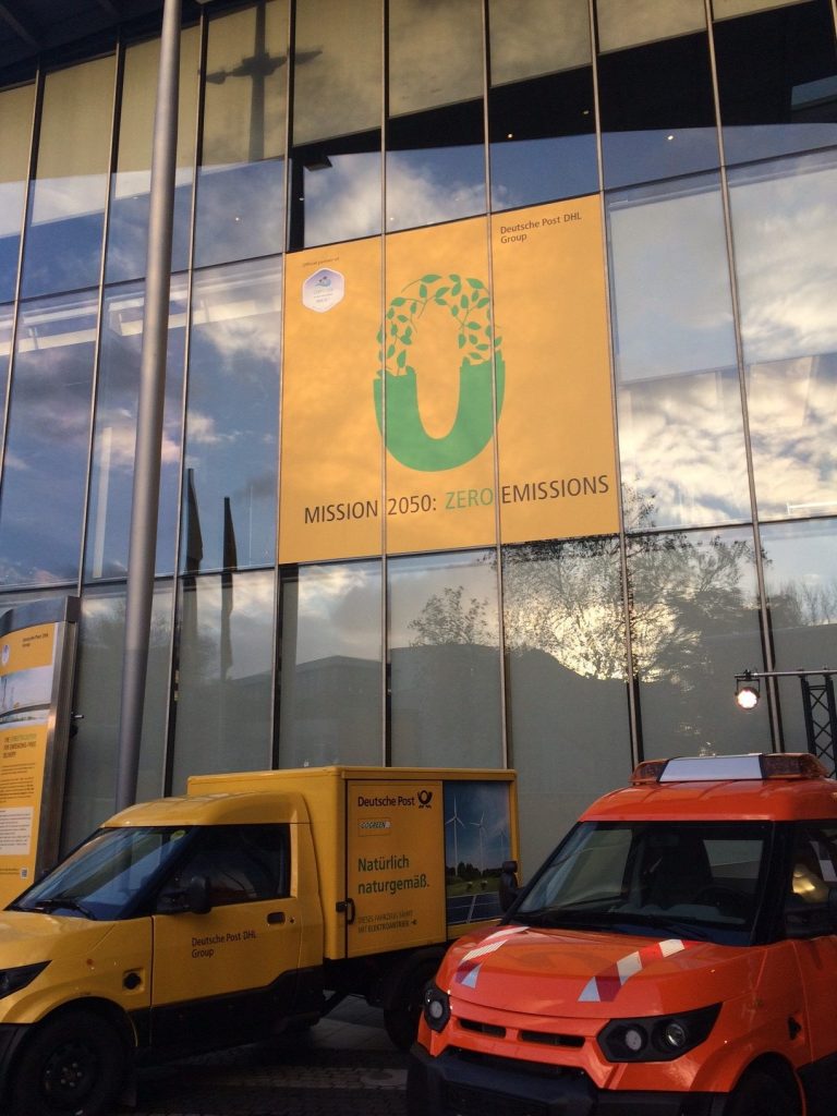 Deutsche Post DHL Group’s own electric delivery vehicles exhibited at Post Tower, Bonn