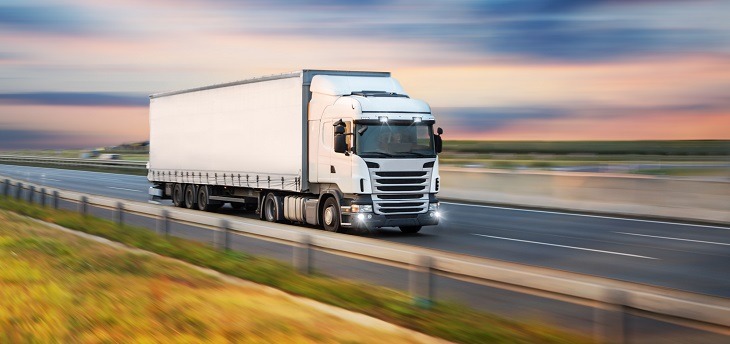 Truck with container on road