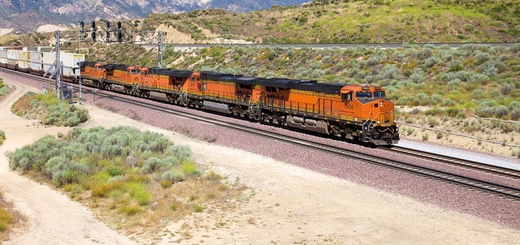 A freight train moving through desert terrain