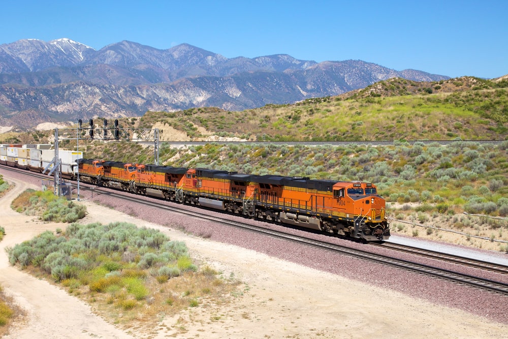 A freight train moving through desert terrain