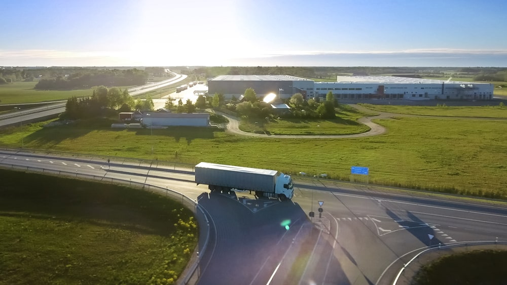 A freight truck moving past a carrier terminal