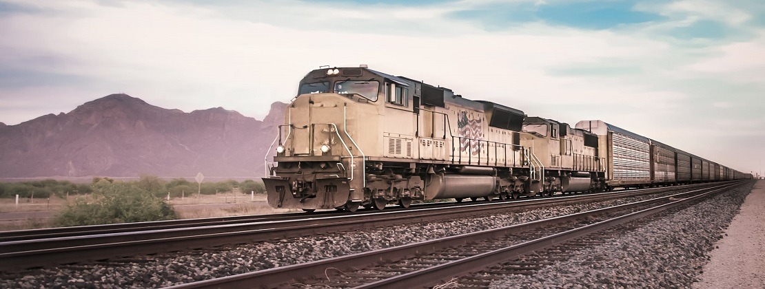 A freight train moving through a desert