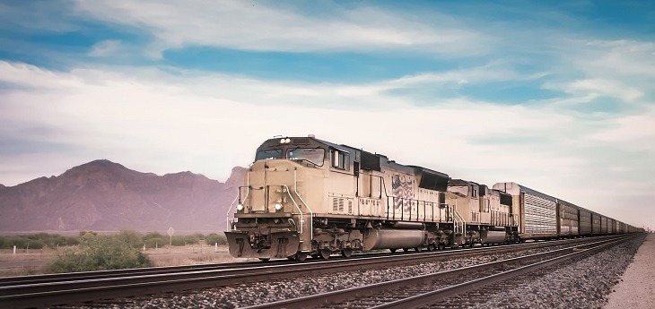 A freight train moving through a desert