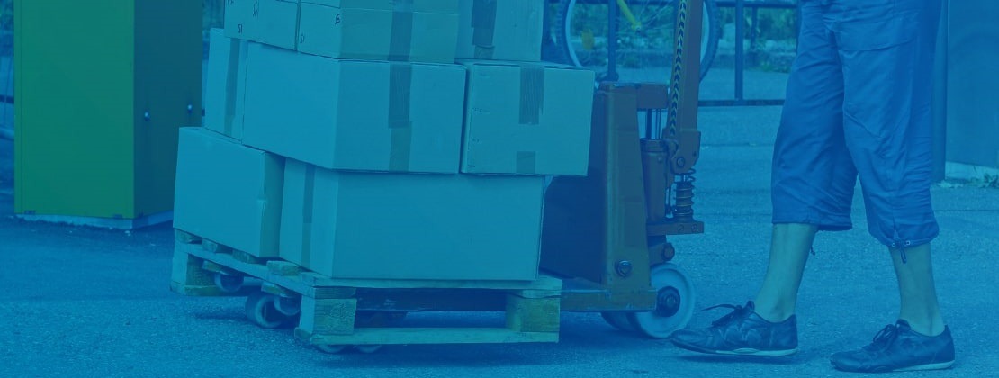 A loaded pallet mounted on a pallet jack