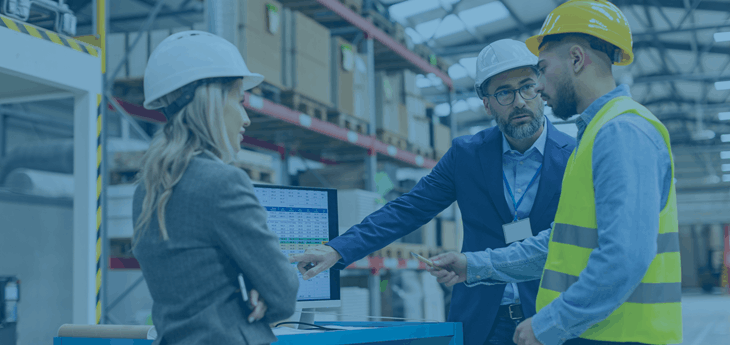 Logistics personell talking in a warehouse