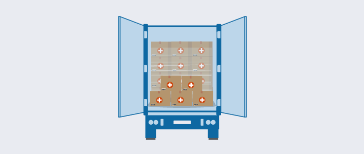 An illustration of a freight truck loaded with essential and medical supplies